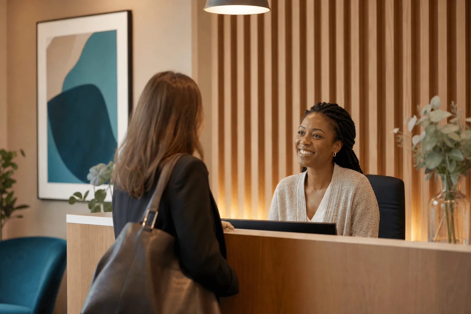 People in conversation around a table in a bright, welcoming room